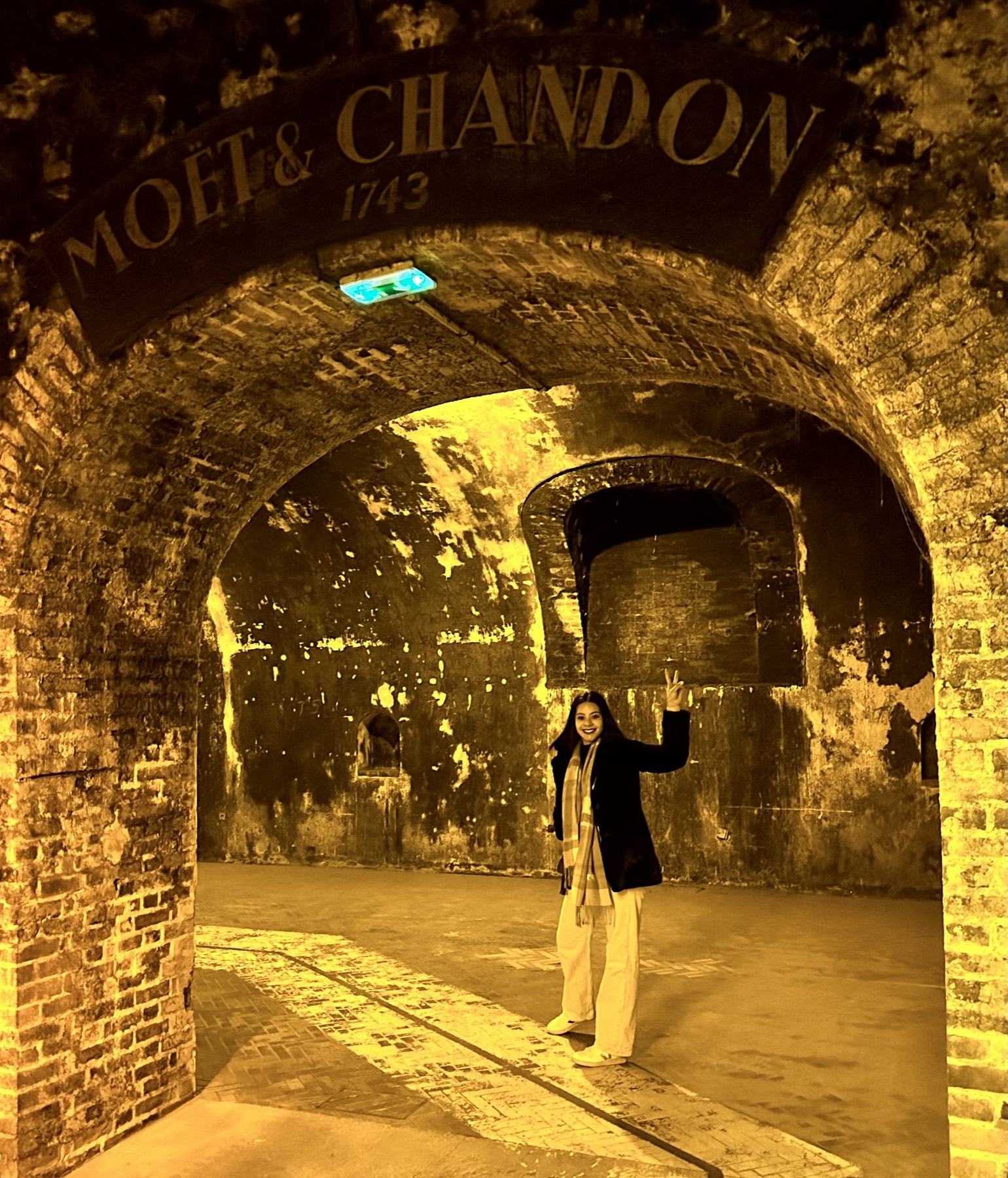 Eliza inside the historic Moët & Chandon cellars