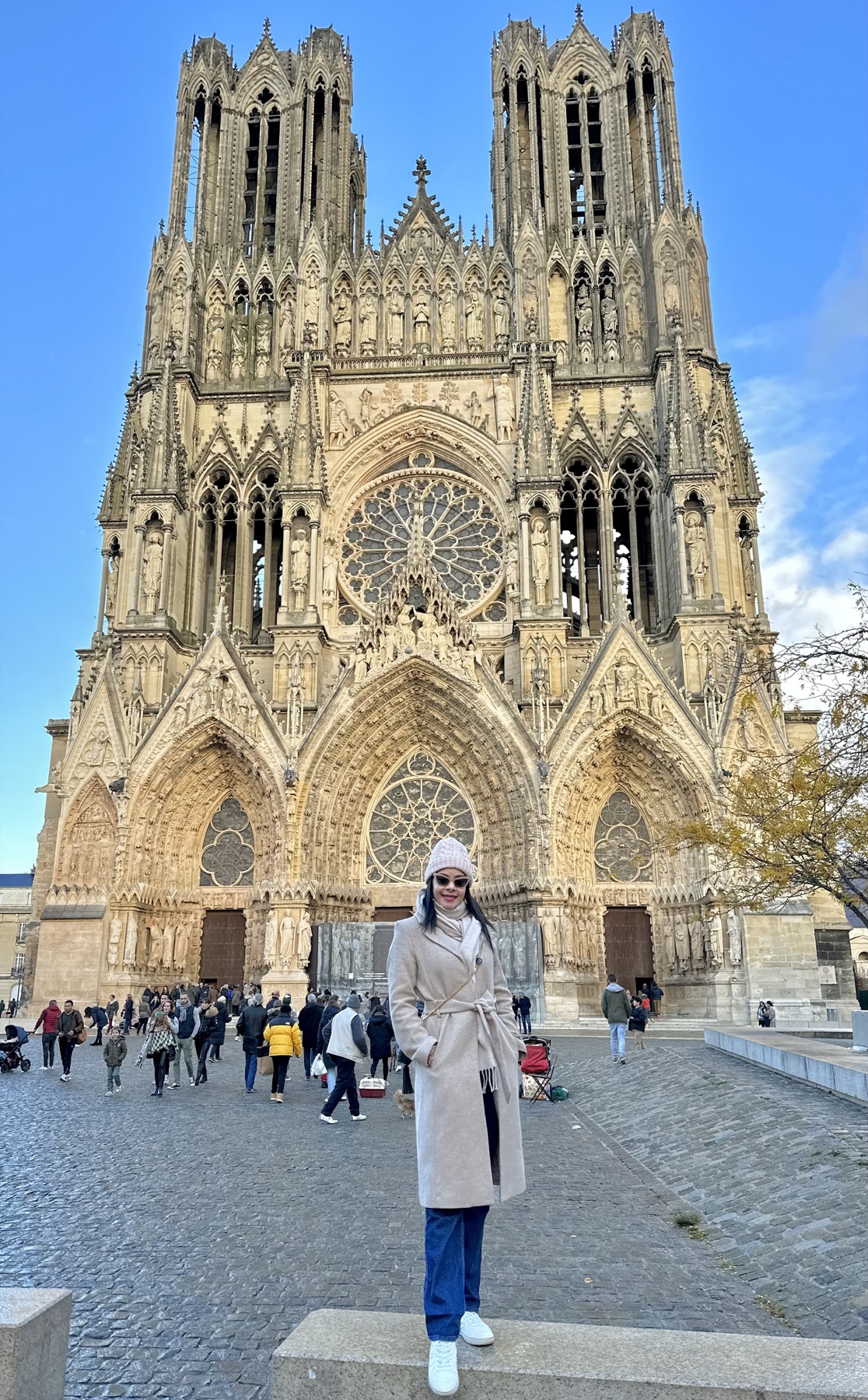 Eliza in front of Notre-Dame Cathedral in Reims