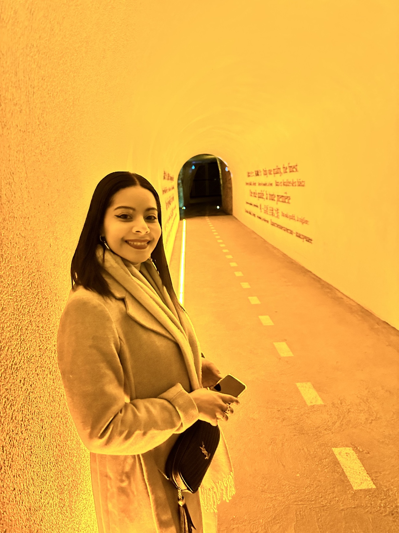 Eliza inside an orange-lit Veuve Clicquot gallery