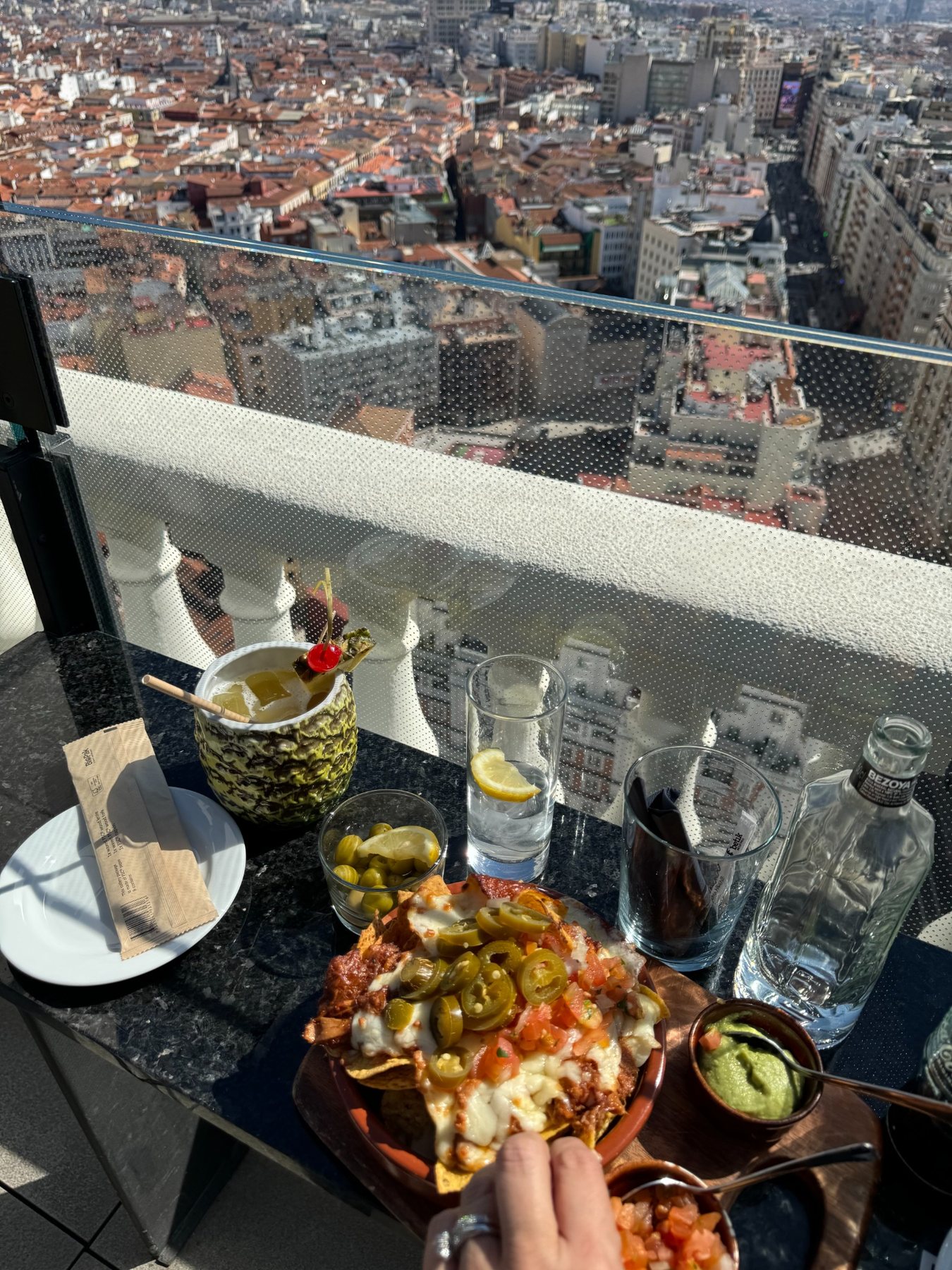 Rooftop drinks and food overlooking Madrid