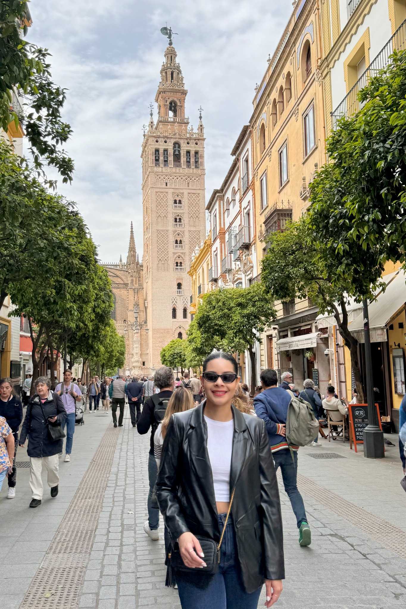 Eliza walking near the Giralda in Seville